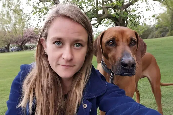 Milena with a Ridgeback looking over her shoulder – dog walking in Kensington.